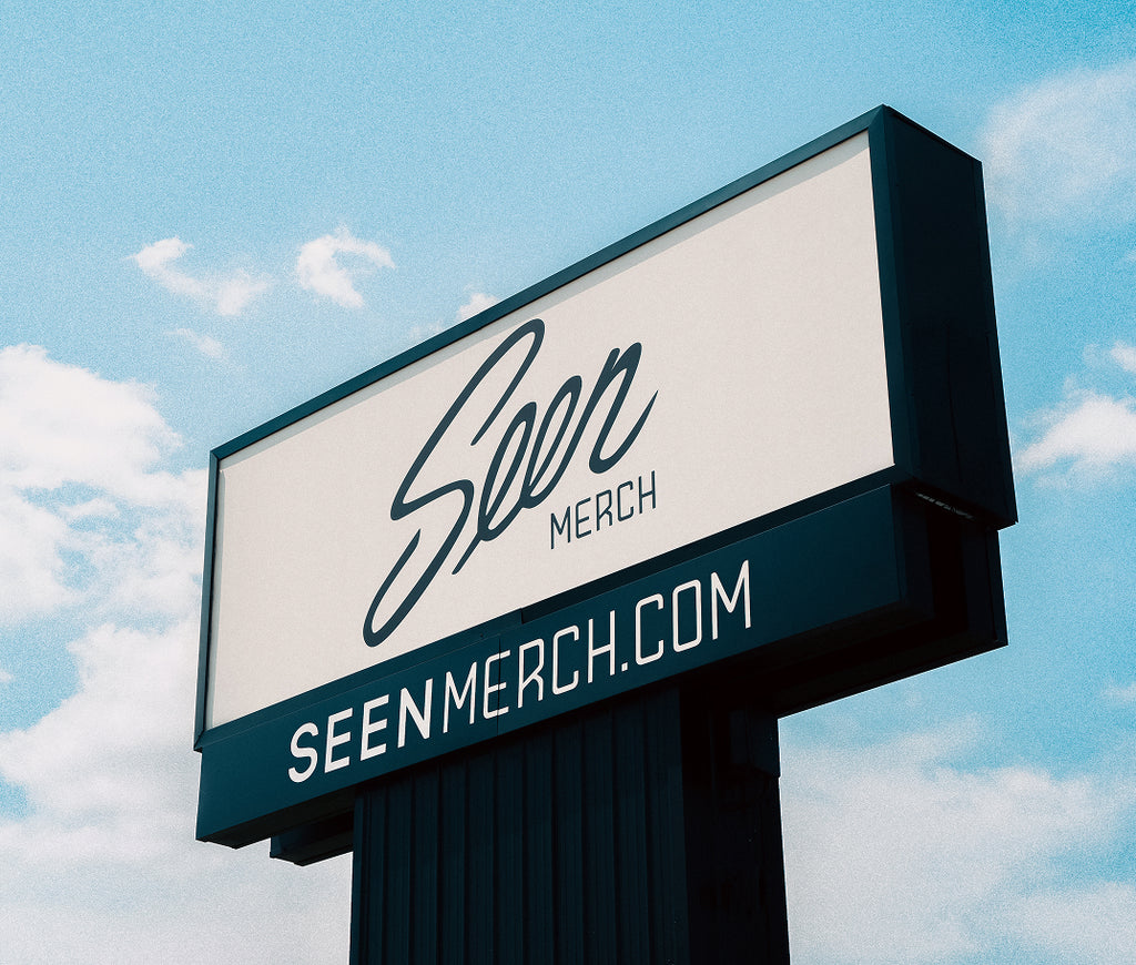 Image of the Seen Merch sign at our location